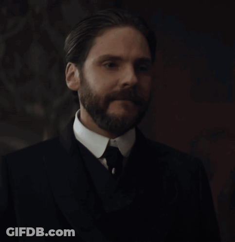 A Man With A Beard In A Suit And Tie GIF