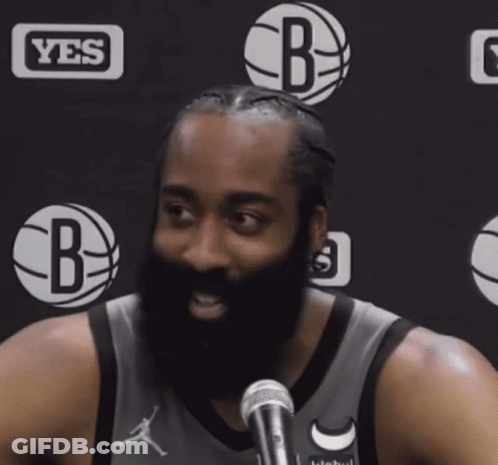 A Man With A Beard In Front Of A Yes Logo GIF