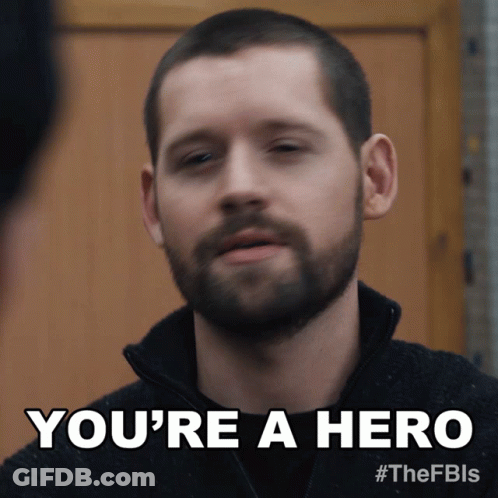 A Man With A Beard Is Being Called A Hero GIF