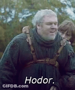 A Man With A Beard Is Carrying A Child On His Back And The Word Hodor Is On The Screen . GIF