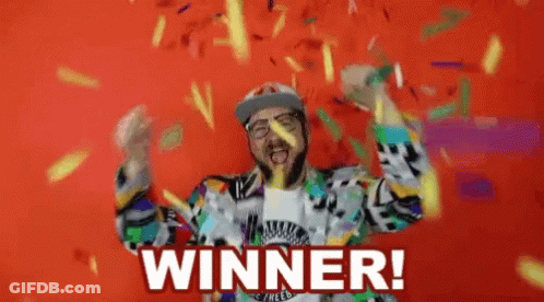 A Man With A Beard Is Celebrating With Confetti And The Words Winner Written On The Bottom GIF