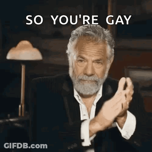 A Man With A Beard Is Clapping His Hands With The Words So You 'Re Gay Behind Him GIF