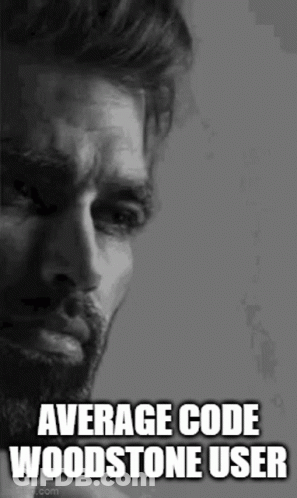 A Man With A Beard Is Crying In A Black And White Photo With The Words `` Average Code Woodstone User '' . GIF