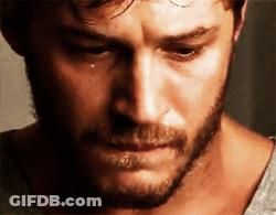 A Man With A Beard Is Crying With A Tear Running Down His Cheek GIF