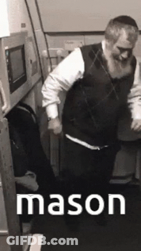 A Man With A Beard Is Dancing In A Room With The Word Mason Written On The Bottom GIF