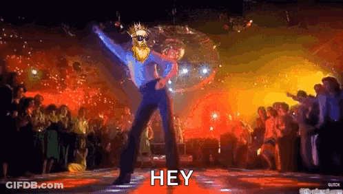 A Man With A Beard Is Dancing In Front Of A Disco Ball In A Nightclub . GIF