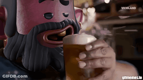A Man With A Beard Is Drinking A Beer From A Glass With Viceland Written In The Corner GIF
