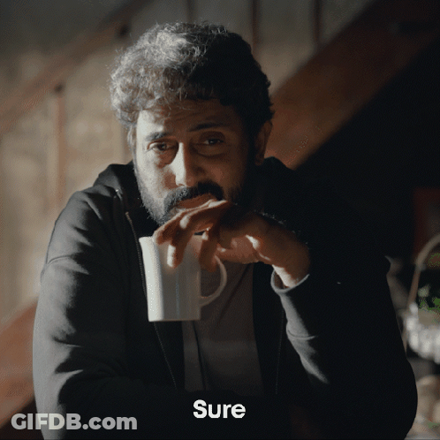 A Man With A Beard Is Drinking From A White Mug And The Word Sure Is On The Bottom GIF