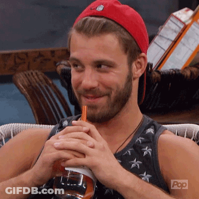 A Man With A Beard Is Drinking Through A Straw From A Bottle . GIF