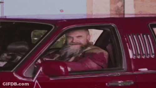 Man With Beard Driving Red Truck GIF