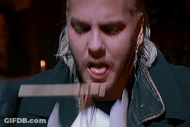 Man With Beard Eating Food With Knife In Mouth GIF