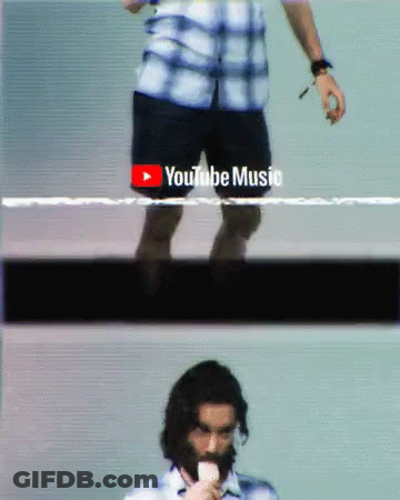 A Man With A Beard Is Eating An Ice Cream Cone In Front Of A Youtube Music Logo GIF