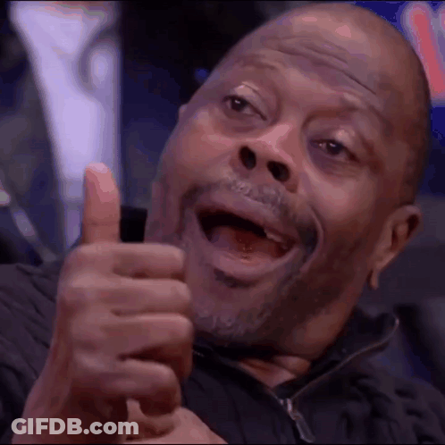 A Man With A Beard Is Giving A Thumbs Up Sign . GIF