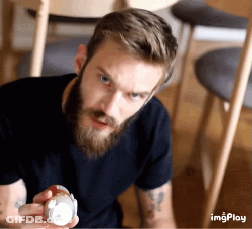 A Man With A Beard Is Holding A Can That Says Imgplay On The Bottom GIF