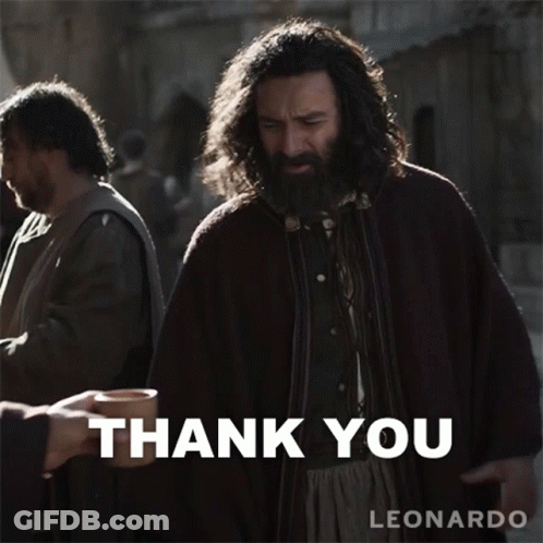 A Man With A Beard Is Holding A Cup In Front Of A Thank You Sign GIF