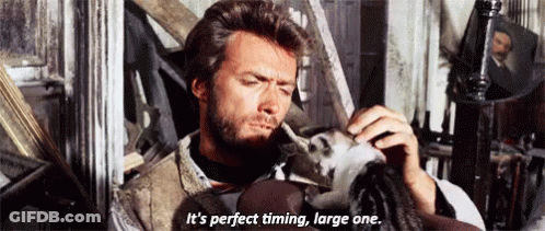 A Man With A Beard Is Holding A Doll And Says It 'S Perfect Timing Large One . GIF