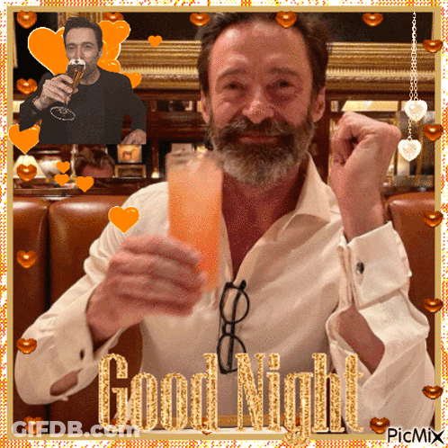 A Man With A Beard Is Holding A Glass Of Orange Liquid With The Words Good Night Written On It GIF