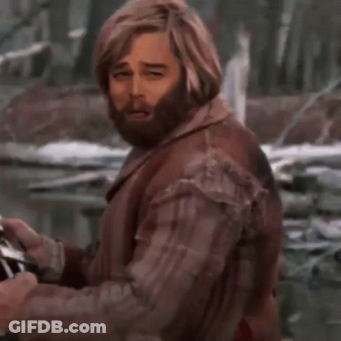 A Man With A Beard Is Holding A Glass Of Wine With A Bubble With The Letter B On It GIF