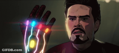 A Man With A Beard Is Holding A Glove With A Bunch Of Stones On It . GIF