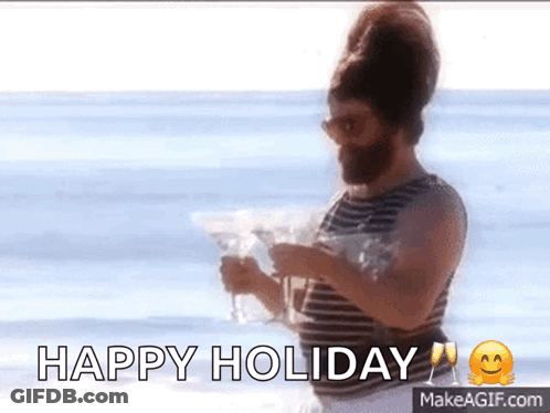 A Man With A Beard Is Holding A Martini On The Beach And Says " Happy Holiday " GIF