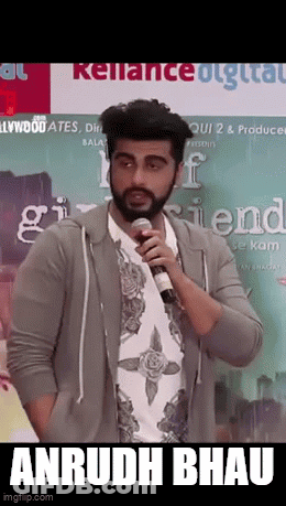A Man With A Beard Is Holding A Microphone And Says " Anrudh Bhau " GIF