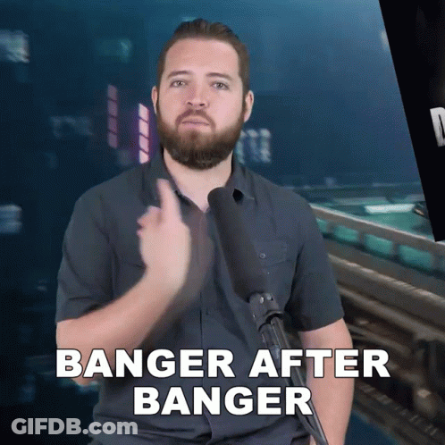 A Man With A Beard Is Holding A Microphone And Says Banger After Banger GIF