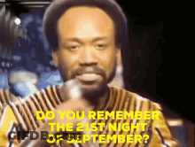 A Man With A Beard Is Holding A Microphone And Says Do You Remember The 21St Night Of September . GIF