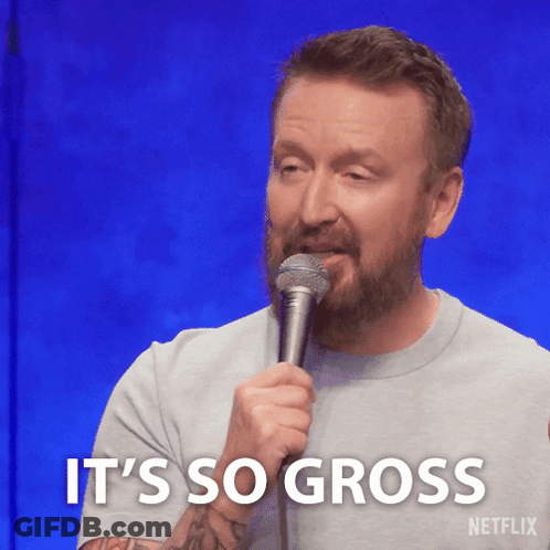 A Man With A Beard Is Holding A Microphone And Says " It 'S So Gross " GIF