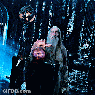 A Man With A Beard Is Holding A Purple Sphere In His Hand GIF