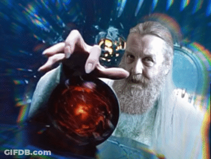 A Man With A Beard Is Holding A Red Sphere In His Hand GIF