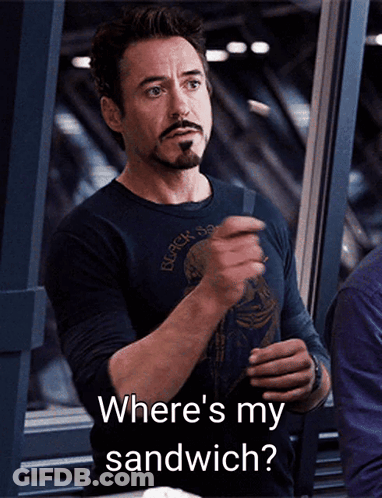 A Man With A Beard Is Holding A Sandwich And Says Where 'S My Sandwich GIF