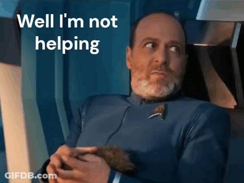A Man With A Beard Is Holding A Small Animal And The Words Well I 'M Not Helping Are Above Him GIF