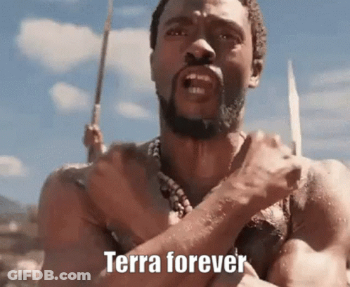 A Man With A Beard Is Holding A Spear In His Hand And Says `` Terra Forever '' . GIF