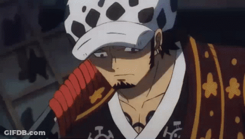 A Man With A Beard Is Holding A Sword And Wearing A Hat . GIF