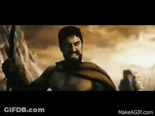 A Man With A Beard Is Holding A Sword In A Battle Scene From The Movie 300 . GIF