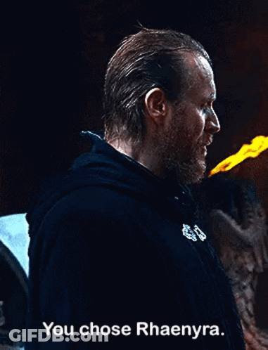 A Man With A Beard Is Holding A Torch In His Hand And Says `` You Chose Rhaenyra . '' GIF