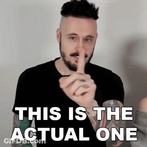A Man With A Beard Is Holding His Finger To His Mouth And Says This Is The Actual One GIF