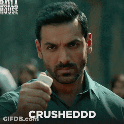 A Man With A Beard Is Holding Something In His Hand And The Word Crushedd Is On The Bottom GIF