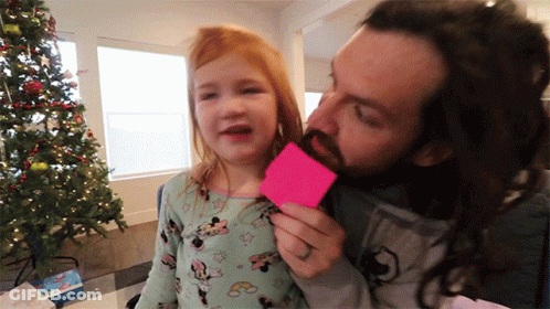 A Man With A Beard Is Kissing A Little Girl Who Is Wearing A Minnie Mouse Outfit GIF