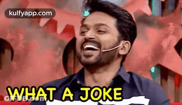 A Man With A Beard Is Laughing And Saying `` What A Joke '' . GIF