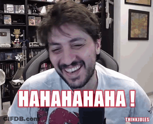 A Man With A Beard Is Laughing In Front Of A Microphone With The Words ' Hahahaha ! ' Below Him GIF
