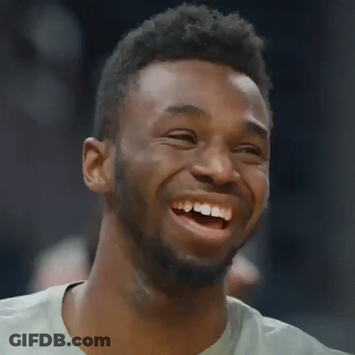A Man With A Beard Is Laughing With His Mouth Wide Open GIF