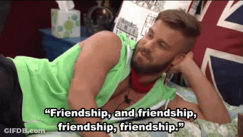 A Man With A Beard Is Laying On A Bed With A Quote About Friendship . GIF