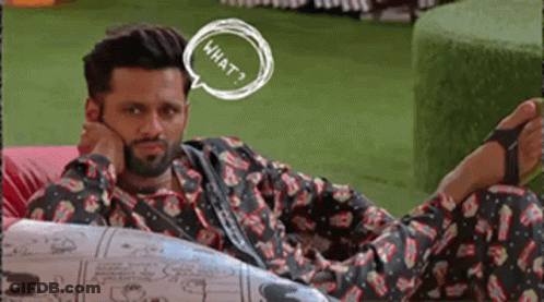A Man With A Beard Is Laying On A Couch With A Speech Bubble That Says What GIF