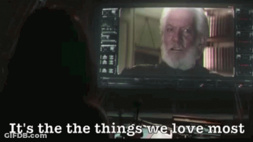 A Man With A Beard Is Looking At A Screen With The Words It 'S The Things We Love Most GIF