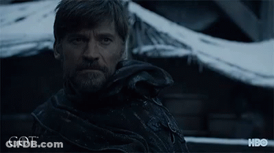 A Man With A Beard Is Looking At The Camera With A Hbo Logo Behind Him GIF