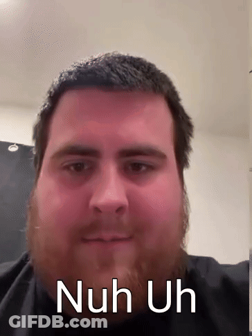 A Man With A Beard Is Looking At The Camera With The Words Nuh Uh Written On His Face . GIF