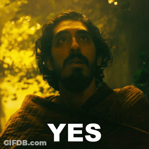 A Man With A Beard Is Looking Up And The Word Yes Is Below Him GIF