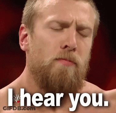 A Man With A Beard Is Making A Face With His Eyes Closed And The Words I Hear You . GIF
