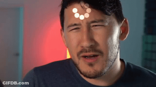 A Man With A Beard Is Making A Funny Face And Has A Circle On His Forehead . GIF